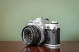 Stunning 1980s Canon AE1 35mm SLR Film Camera + Canon 50mm F1.8 FD S.C. Lens - Silver